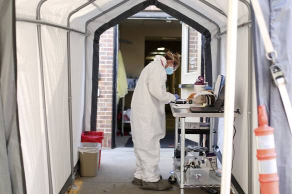 A medical worker at a coronavirus drive-through testing site in Casper, Wyoming, this month.