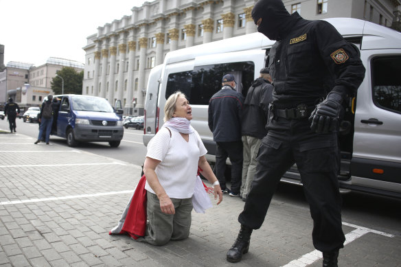 A woman argues with a policeman during a protest in Minsk, Belarus, on Tuesday.