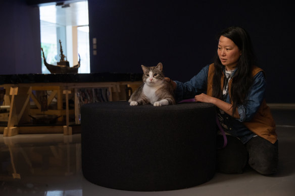 Candice Lin with Kovu, the cat who will lead tours of the artist’s exhibition at the Monash University Museum of Art. 