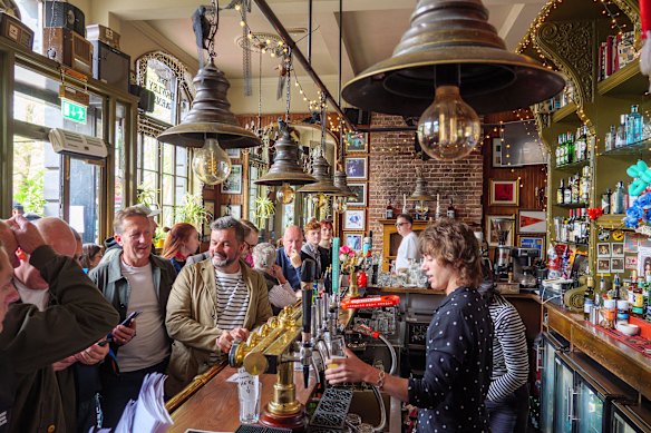 Bars are designed for people to wait along, not queue up behind one another.