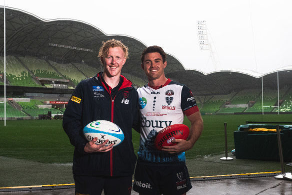 Melbourne Demons player Clayton Oliver and Melbourne Rebel Andrew Kellaway at AAMI Park. 