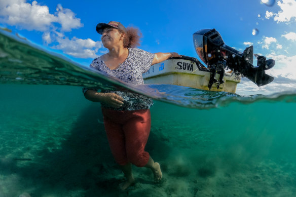 Adi Paulini Lalabalavu-Naulago with the boat her family uses for fishing in Sigatoka. 