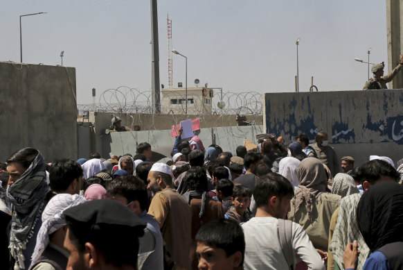 Hundreds of people gathered at an evacuation control point in the days before the bombing. 