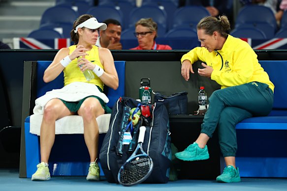 Kim Birrell speaks with Stosur during her match against Great Britain’s Harriet Dart.