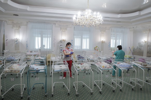 Nurses care for newborn babies at a hotel in Kyiv, Ukraine. During the pandemic, many babies could not be picked up due to border closures. 