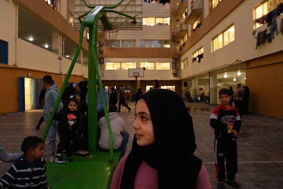 Children run through the hallways and play football on the bitumen outside a shelter near Beirut’s docks.