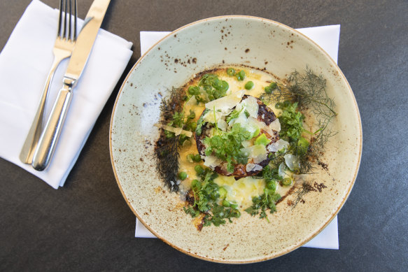 The twice cooked goat cheese souffle, with snow pea cream, broad beans, peas, lemon and parmesan at Cafe Sydney.