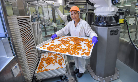 On the factory floor at Blackmores, Ruby Mongoso operates robots on the production line.