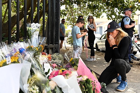 Laura Walkerden prays at one of the memorial sites at Bondi Beach near the crime scene of last night’s mass shooting incident that has left 16 dead and dozens hospitalised.