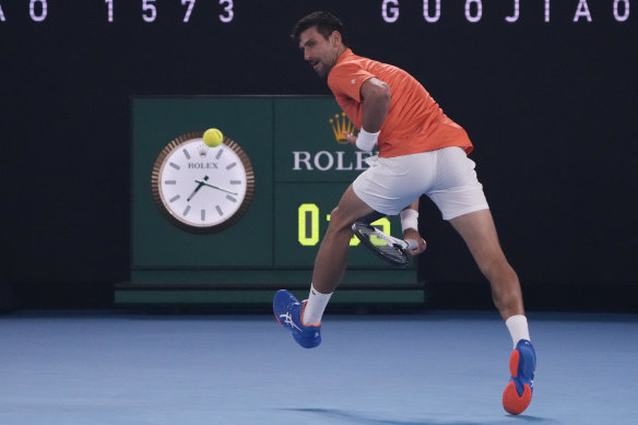 Novak Djokovic plays a shot between his legs during an exhibition match against Nick Kyrgios last week.