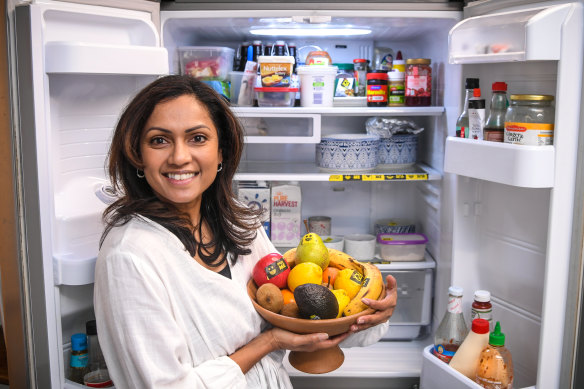 Violet Francis with the use-it-up tape inside her fridge. 