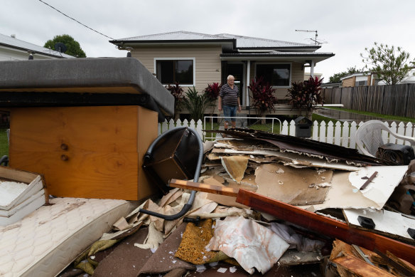 Robert Graham surveys his waterlogged possessions.