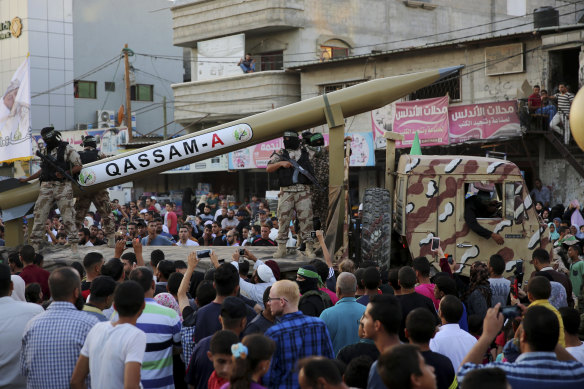 A Qassam A rocket mounted parades through Rafah in the Gaza Strip, in 2016.