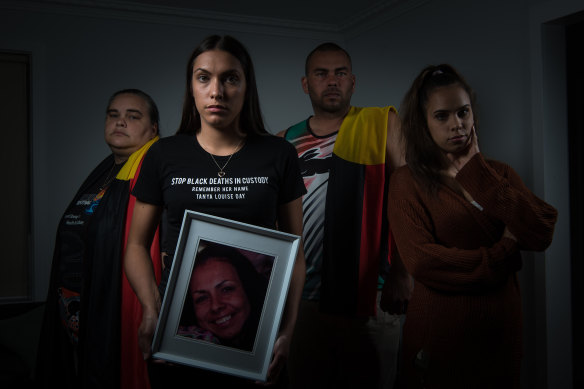 Tanya Day's children: (L-R) Belinda Stevens, Apryl Watson (with pic of Tanya), Warren Stevens and Kimberly Watson.