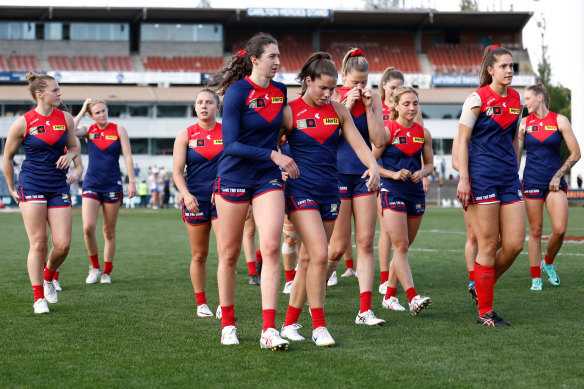 The Demons leave the field after a comprehensive loss.