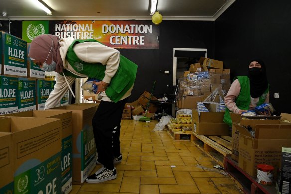 Human Appeal Australia volunteers and university students Rokaya Breis (left) and Maysa Amine (right) pack hampers in Lakemba.