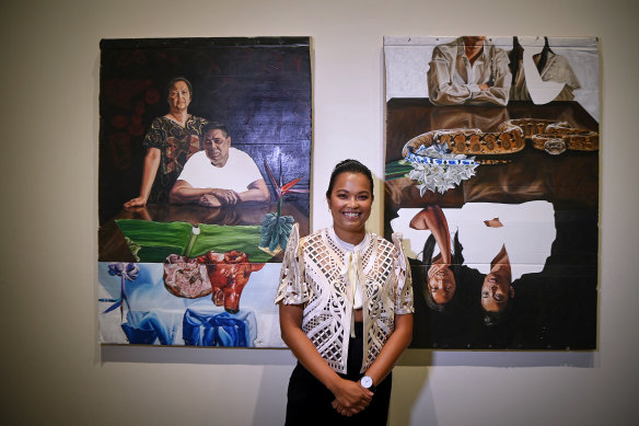 Marikit Santiago, recipient of the 2024 La Prairie Art Award, with her paintings A Seat at the Table (Magulang) and A Seat at the Table (Kapatid).