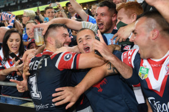 James Tedesco celebrates with fans.