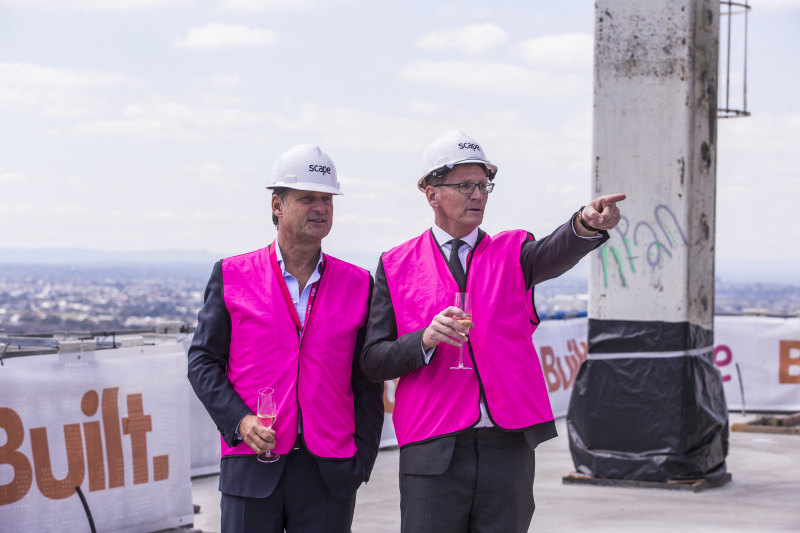 Scape’s Craig Carracher, right, with co-founder Tim Ward at a topping-out ceremony in 2017.