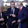 President Donald Trump shakes hands with Bernard Arnault, chief executive of LVMH, during a ribbon cutting ceremony at the Louis Vuitton Workshop Rochambeau in Alvarado, Texas, Thursday, Oct. 17, 2019. At left is Michael Burke, chairman and chief executive officer of of Louis Vuitton - LVMH. (AP Photo/Andrew Harnik)