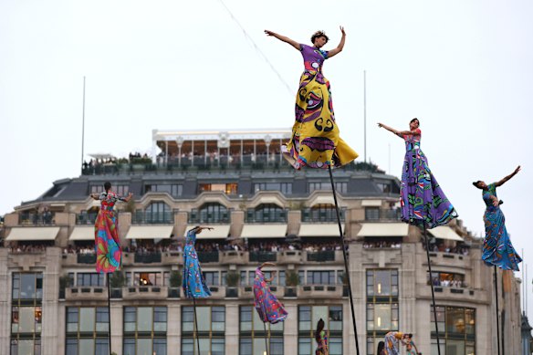 Artists performing during the ceremony despite heavy rain. 