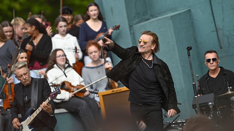 U2 rock their old school with surprise concert to mark 50 years