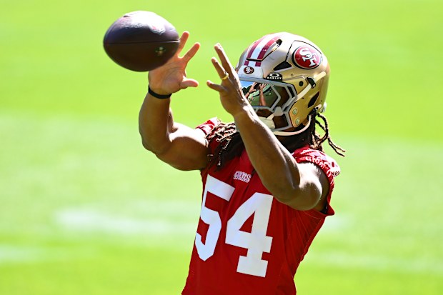 Fred Warner #54 of the San Francisco 49ers catches the ball during a Melbourne media session.