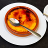 A couple was charged more than $2.50 by a restaurant in Italy for providing an extra spoon with their crema catalana.