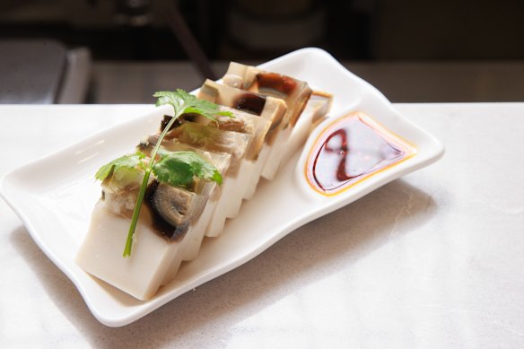 Dongbei jelly is a two-layer creation of tofu and pork and century egg jelly.