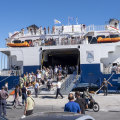 A ferry disgorging its passengers.