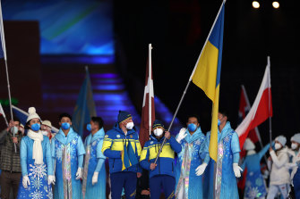 Ukraine’s flag bearer Vitalii Lukianenko during the closing ceremony of the Winter Paralympics at the Beijing National Stadium on Sunday.