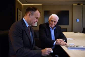 Atomo Diagnostics founder John Kelly and investor Lang Walker with the company’s flagship  product, a HIV test.