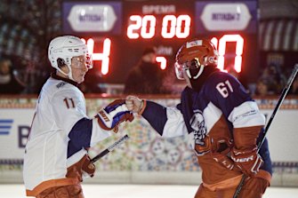 Russian President Vladimir Putin, left, and Vladimir Potanin congratulate each other after a hockey match in Moscow in 2018.