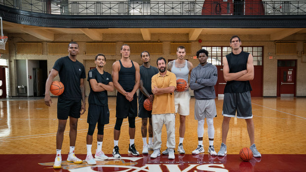 (L-R) Mike Foster Jr. as Zeke Washington, Trae Young as Himself, Aaron Gordon as Himself, Jordan Clarkson as Himself, Adam Sandler as Stanley Sugerman, Juancho Hernangomez as Bo Cruz, Anthony Edwards as Kermet Wilts and Boban Marjanovic as Big Serbian Center in Hustle.