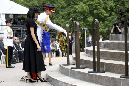 Prince Harry, and his wife Meghan, the Duchess of Sussex, lay a wreath at the official opening of Anzac Memorial at Hyde Park.
