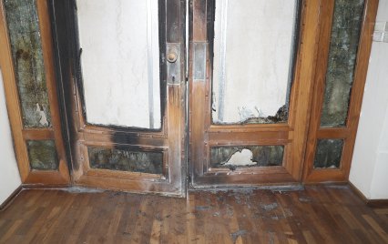 Damage to the front door of Old Parliament House caused by a fire in January.