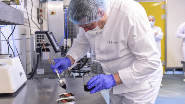 A member of French chef Alain Ducasse’s team prepares a low-temperature cooked salmon for the French astronaut Thomas Pesquet at the canning factory Henaff in Pouldreuzic, near Brest, western France.