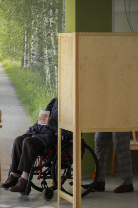 A voter leaves a polling booth at a polling station in Turku, Finland.
