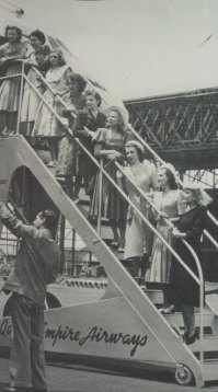 The first intake of nine Qantas flight hostesses study the exterior structure of the Lockheed Constellation 749, February 1948. Patricia Burke, second from top.