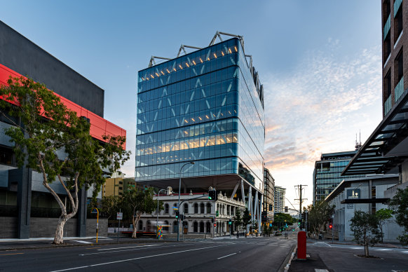 One of Brisbane’s latest developments, Jubilee Place, towers over an old pub near the Ekka. The architects say it is Australia’s tallest diagrid building.