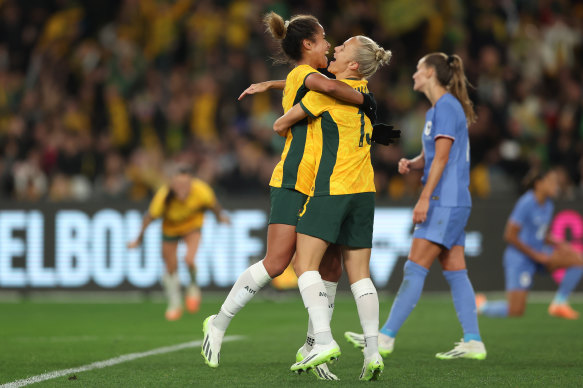 Mary Fowler, left, is hugged by Tameka Yallop.