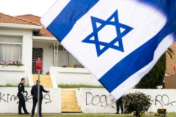 The flag of Israel, raised in solidarity with Jewish Australians, billows in front of a house in the Sydney suburb of Maroubra, which was vandalised with antisemitic graffiti on Thursday. 