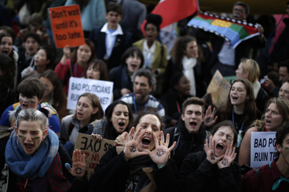 Protesters call for action outside the COP25 climate talks in Madrid.