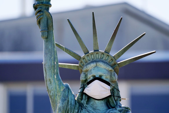 A face mask has been placed on a replica of the Statue of Liberty in Seattle. 