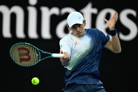 Alex de Minaur plays a forehand in his opening-round match.