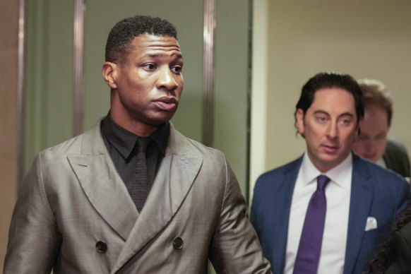 Jonathan Majors (left), entering a courtroom at the Manhattan criminal courts, New York, this week.