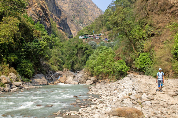 Trekking beside the rushing snow melt of Langtang Khola.