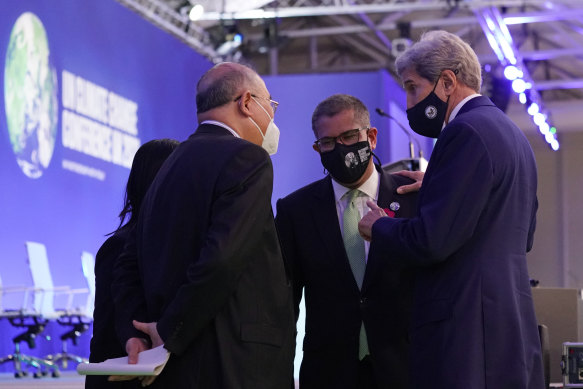 China’s chief negotiator Xie Zhenhua, left, talks with UN climate summit president Alok Sharma, and John Kerry, US Special Presidential Envoy for Climate in November 2021. China has now suspended bilateral climate talks with the US.
