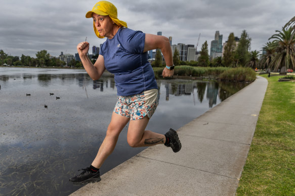 Comedian Geraldine Hickey hits the running track at Melbourne’s Albert Park Lake.