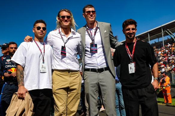  Collingwood AFL team players Jamie Elliott, Darcy Moore, Darcy Cameron and Josh Daicos during the F1 Grand Prix of Australia at Albert Park Circuit on March 24, 2024 in Melbourne, Australia.